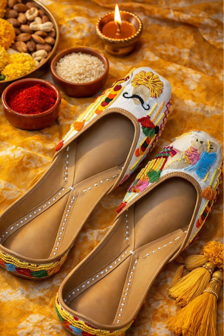 Colorful embroidered sandals on a yellow fabric background with decorative elements.